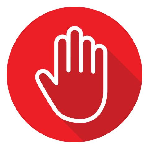 Red circle with outline of a hand in a stop position