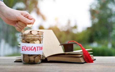 jar with coins saying education