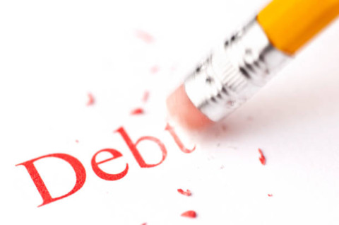 pencil rubbing out the word debt