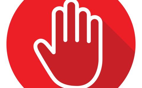 Red circle with outline of a hand in a stop position
