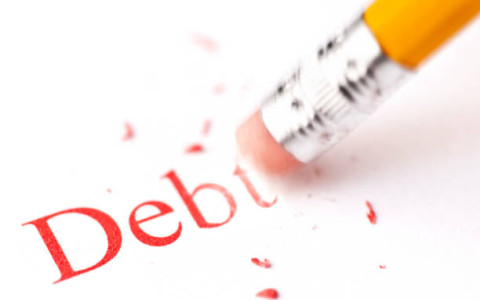 pencil rubbing out the word debt